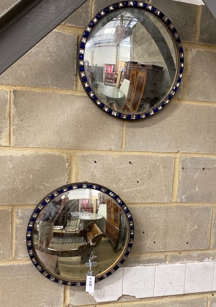 A pair of circular Irish style convex wall mirrors, diameter 43cm